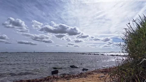 TimeLaps Clouds over the water to the left Video stock 295052651