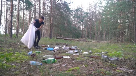 Timelaps eman cleans garbage in forest. Ecology and environment concept Stock Footage 118319439