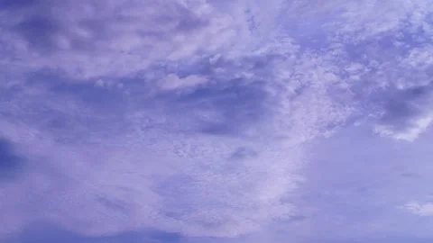 Timelaps fluffy white cloudscape drifts across the bright blue summer sky Stock Footage 324130702