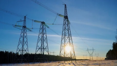 TIMELAPS: high voltage electricity pylons with wires against sunset Stock Footage 106310380