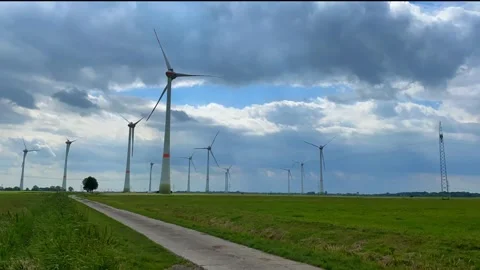 Timelaps Industrial Windfarm Power Wind Turbines cloudy sky Stock Footage 281469764