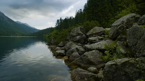 Timelaps of lake in the mountains among trees 4k HDR H264 Stock Footage 88274868