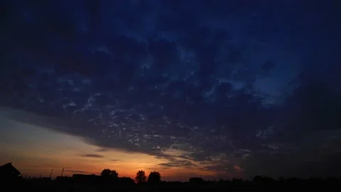 Timelaps movement of clouds in the sky at sunset. Beautiful orange sunset in the Stock Footage 169038176