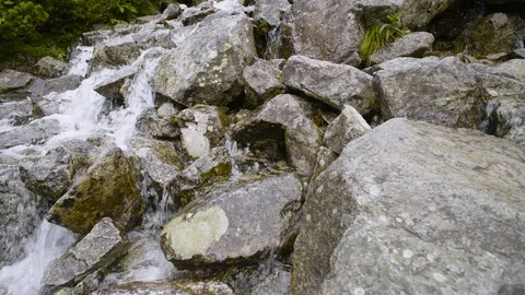Timelaps of stones in mountain stream 4k HDR H264 Stock Footage 88271050