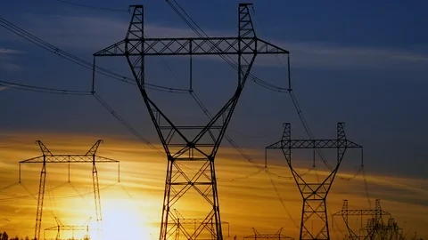 TIMELAPS: sun setting behind high voltage power transmission towers Stock Footage 106311229