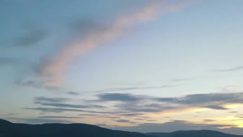 Timelaps of Sunset Sky Over Mountains Stock Footage
