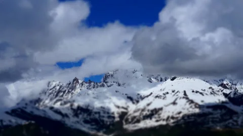 TIMELAPS top of Mount Ushba with running clouds Stock Footage 64883388