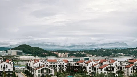 Timelaps, villages in the mountains, when it rains and the sun shines in the Stock Footage 82656162