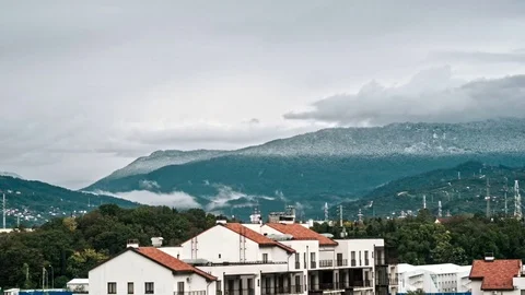 Timelaps, villages in the mountains, when it rains and the sun shines in the Stock Footage 82656296