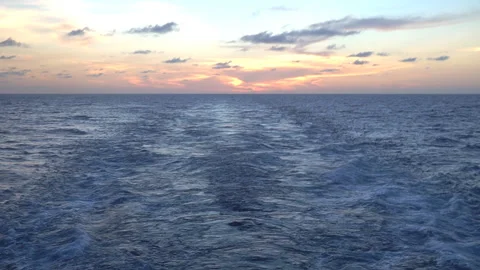 Timelaps of a wake on the sea surface at sunset. Stock Footage 99360775