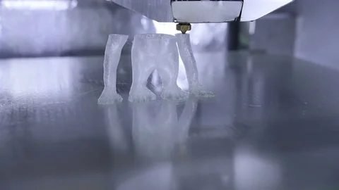 Timelapse of 3D printer print the human like monkey using plastic filament Stock Footage 69839335