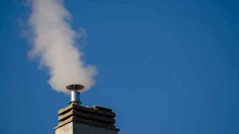Timelapse 4k of a chimney of the condominium heating system. The low rays of the Stock Footage 102867732