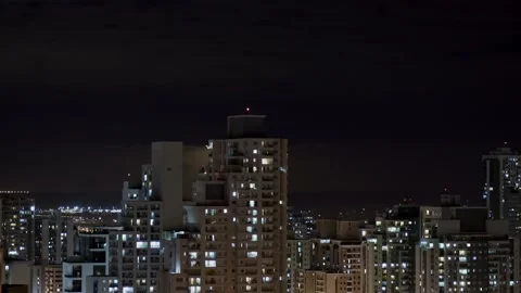 Timelapse in 4k Clouds and Full Moon At Night - city skyscrapers, planes flying Video stock 141226875