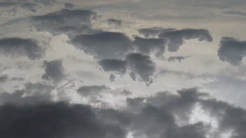 Timelapse 4K Dramatic Rainy Sky with Gray Cumulus Clouds in The Sunlight. Beauti Stock Footage 233781057