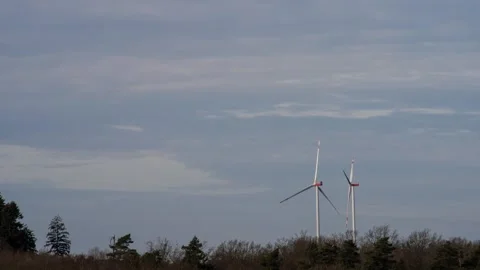 Timelapse 4K video of two non-working wind turbines Stock Footage 302586825