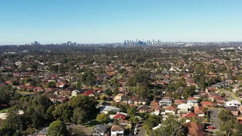 Timelapse aerial flying to distant Sydney city CBD over Greater Sydney 4k. Stock Footage 156326577