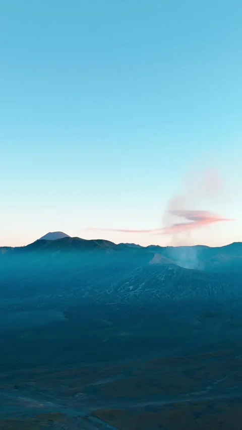 Timelapse aerial of Mount Bromo volcano crater and clouds at sunset in Java 動画素材 314301875