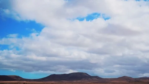 Timelapse Aerial Shot Of Clouds Rolling Over Mountains Stock Footage 72407046