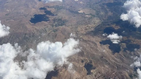 Timelapse of an aerial view of scenery over the clouds Stock Footage 337189315