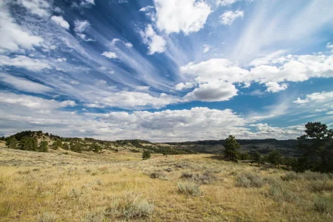 Timelapse afternoon clouds passing over prairie slopes in summer Stock Footage 62195250