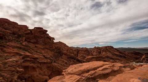Timelapse afternoon clouds passing over red rock canyon in Nevada desert Stock Footage 62633005