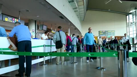 Timelapse of airline passengers checking in at the security line at the Airport Stock Footage 63217277