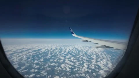 Timelapse of Airplane Flying Above Clouds Through Turbulent Skies Stock Footage 339952291