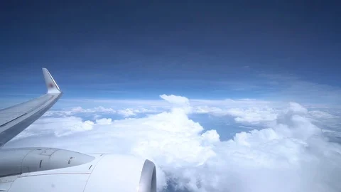 Timelapse from an airplane window. Beautiful sky with clouds. Stock Footage 120444599