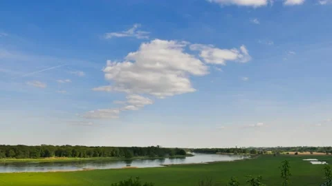 Timelapse of almost clear bright sky with clouds over river Oder in East Germany Stock Footage 134808860