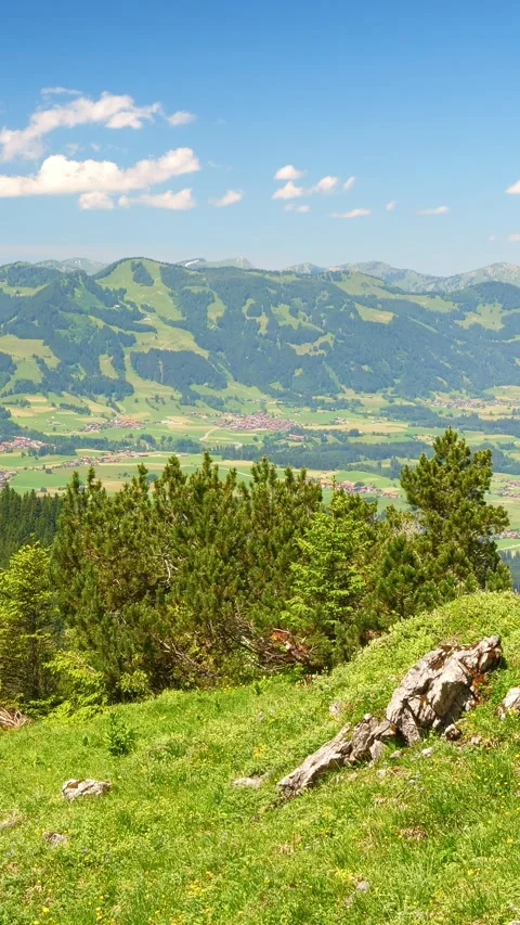 Timelapse of Alpine Spring Awakening, Featuring Lush Green Hills, Snow-Capped Video stock 309233346