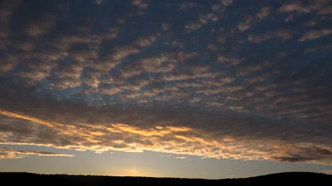 Timelapse of Altocumulus Undulatus Sunset Clouds Over Hills Stock Footage 317820212
