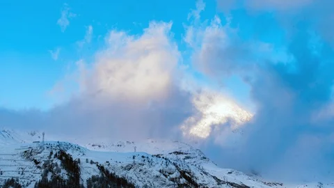 Timelapse of amazing clouds surrounding mountains Stock Footage 93698657