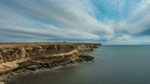 Timelapse amazing fast moving clear blue sky with white fluffy clouds over Stock Footage 101834715