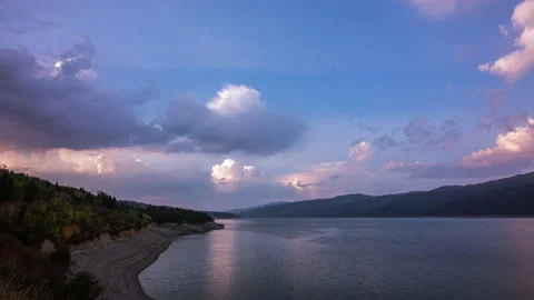 Timelapse - Amazing mountain landscape with dramatic clouds above the reservoir Vídeos de archivo 161117777