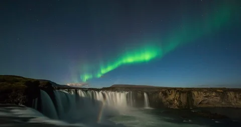 Timelapse of amazing northern lights over waterfall in Iceland Stock Footage 105620053