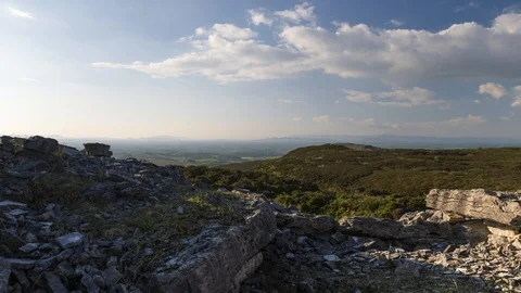 Timelapse of Ancient Prehistoric Tomb Stone Structure with Moving Clouds Ireland 動画素材 101095223