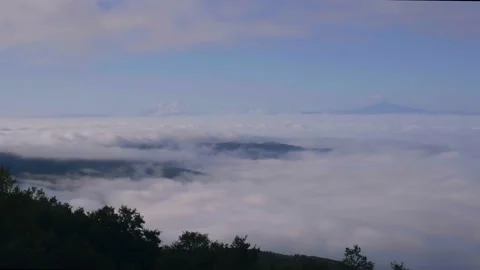 Timelapse of of and clouds on the mountain. View of the cloudy valley and fog Stock Footage 141591684