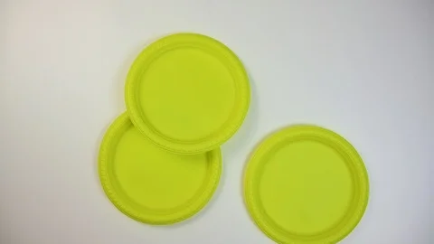 Timelapse and video plastic appears on the table and his hand brushes it away Stock Footage 124913763