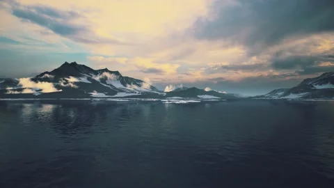 Timelapse animation of landscape with floating ice fragments on still dark blue Stock Footage 201875449