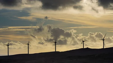 Timelapse - Arieal view of multiple wind turbines on the hills in Hawaii Stock Footage 234834797