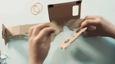 Timelapse assembling a Virtual Reality cardboard headset Stock Footage 63187059