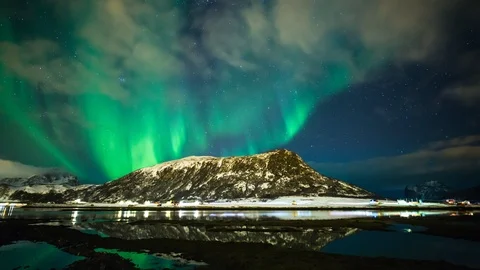 Timelapse of aurora borealis with mountain reflection in mirror lake Stock Footage 92033426