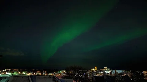 Timelapse of aurora borealis moving over the city and Reykjavik center at night Video stock 73011561