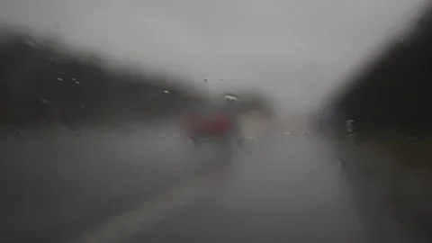 Timelapse autumn rain on car windshield window with road background Stock Footage 142329216