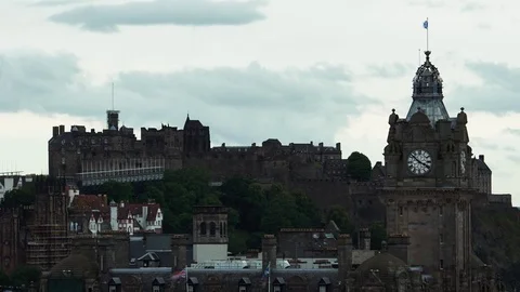 Timelapse of The Balmoral Hotels clock tower with Edinburgh Castle Stock Footage 77813922