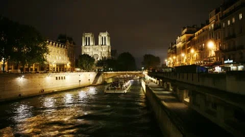 Timelapse of barges moving through a canal in front of the Cathedral Notre Dame Stock Footage 11629113