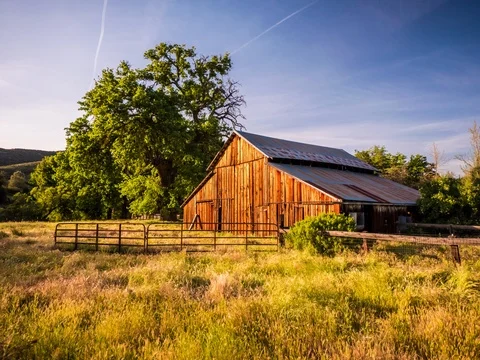 Timelapse of Barn with Moving Clouds 4.6K Stock Footage 81572657