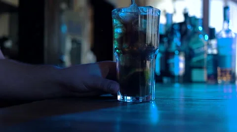 Timelapse: Bartender mixing alcohol and poured it into a cocktail glass in the Stock Footage 68549724