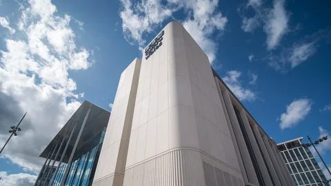 Timelapse BBC Wales headquarters clouds blue sky Stock Footage 115658614