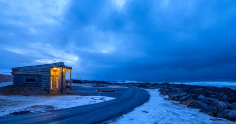 Timelapse of beach cabin with stormy clouds and sea on Skagsanden beach in the Stock Footage 251163761